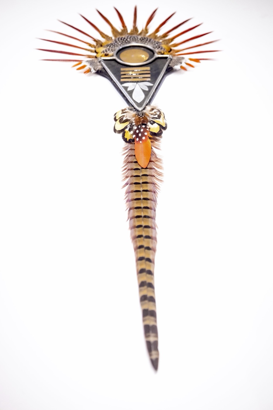 Golden Embers, a cascading vertical featherwork sculpture in warm gold tones