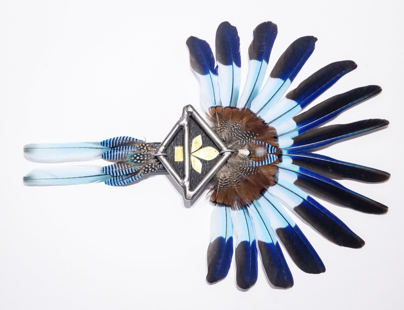 Hues of Blues, a compact starburst featherwork sculpture in cobalt and sky blue